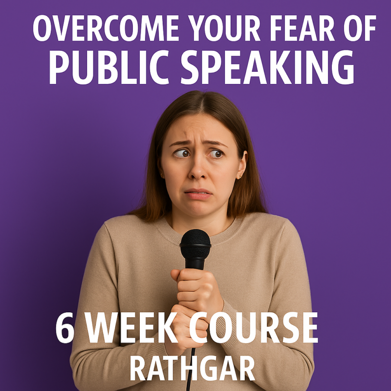 A nervous woman stands in front of a microphone, looking anxious and overwhelmed, with blurred figures of an audience in the background.